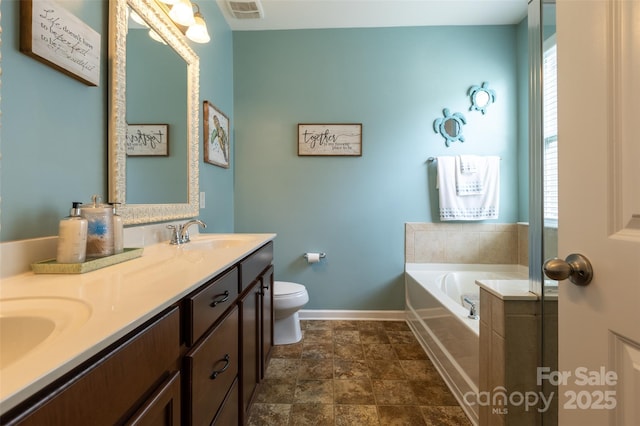 3186 Helmsley Ct, Concord, NC 28027 - full bathroom with visible vents, a garden tub, toilet, baseboards, and a sink