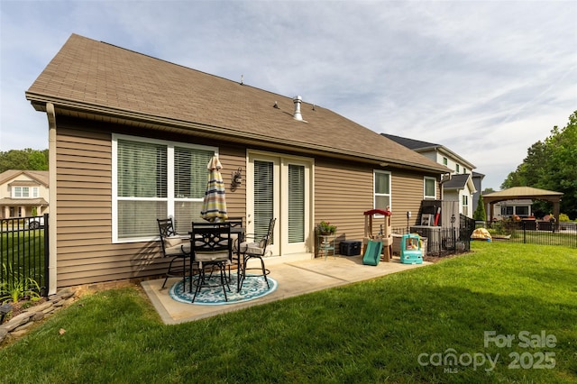3186 Helmsley Ct, Concord, NC 28027 - rear view of property with fence, a shingled roof, a yard, and a patio area