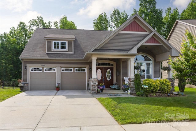 3186 Helmsley Ct, Concord, NC 28027 - craftsman house featuring roof with shingles, a front yard, fence, concrete driveway, and stone siding
