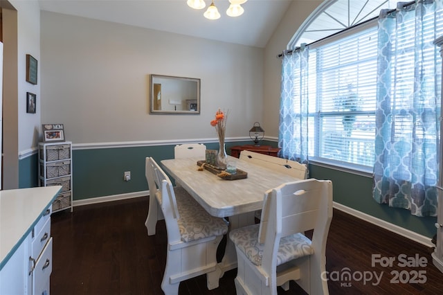 3186 Helmsley Ct, Concord, NC 28027 - dining area with dark wood-style flooring, a notable chandelier, lofted ceiling, and a wealth of natural light