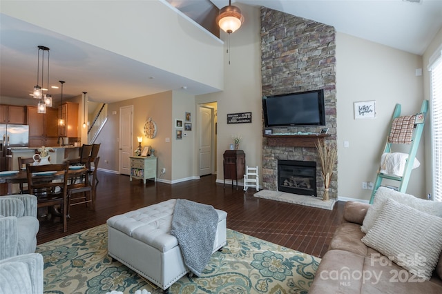 3186 Helmsley Ct, Concord, NC 28027 - living area with a fireplace, baseboards, high vaulted ceiling, and dark wood-type flooring