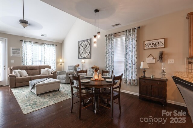 3186 Helmsley Ct, Concord, NC 28027 - dining space with lofted ceiling, dark wood-style flooring, and visible vents