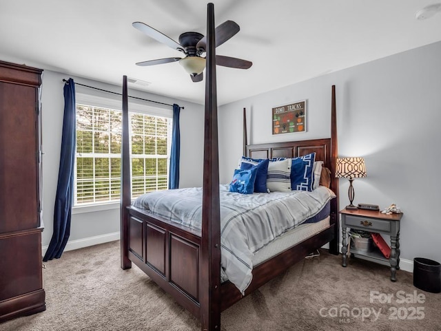 bedroom featuring light colored carpet, baseboards, ceiling fan, and visible vents