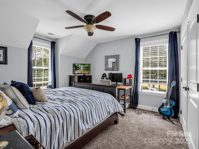 carpeted bedroom featuring baseboards, visible vents, ceiling fan, and lofted ceiling