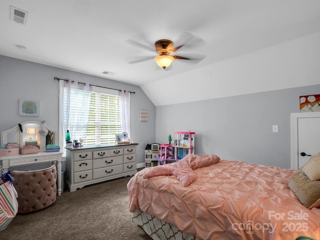 carpeted bedroom featuring visible vents, a ceiling fan, and vaulted ceiling