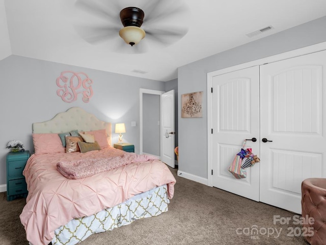 carpeted bedroom with baseboards, ceiling fan, a closet, and visible vents