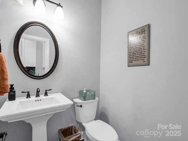 bathroom with a sink and toilet