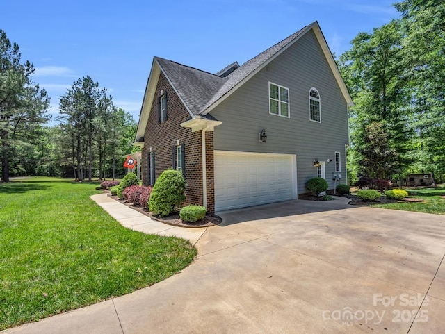 view of side of home featuring a yard, a garage, brick siding, concrete driveway, and a shingled roof