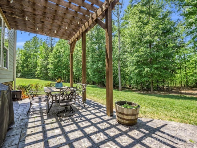 view of patio / terrace with a pergola and outdoor dining space