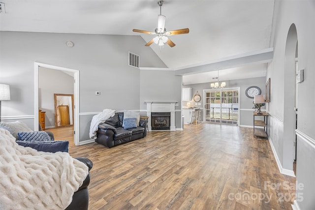 311 Masters Dr, Rock Hill, SC 29732 - living room with ceiling fan, arched walkways, wood finished floors, a fireplace, and high vaulted ceiling