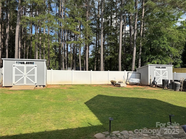 311 Masters Dr, Rock Hill, SC 29732 - view of yard with a storage shed, an outbuilding, and view of wooded area