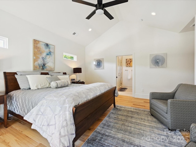 bedroom with light wood-style floors, vaulted ceiling, recessed lighting, and visible vents