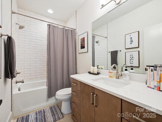 bathroom featuring vanity, tile patterned flooring, shower / bath combo, and toilet