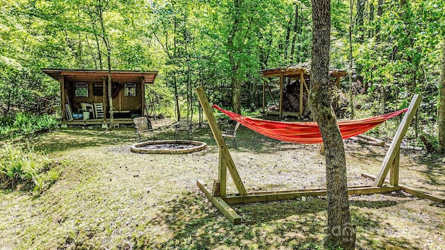 164 Forest Ridge Dr, Rutherfordton, NC 28139 - view of playground with a view of trees and a fire pit