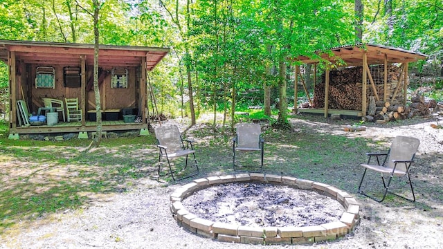 164 Forest Ridge Dr, Rutherfordton, NC 28139 - view of yard featuring a fire pit and an outbuilding
