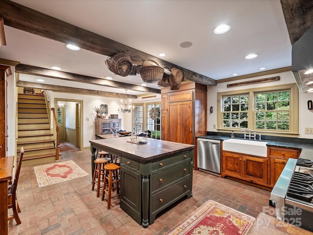 kitchen with dishwasher, a sink, brick flooring, butcher block countertops, and beamed ceiling
