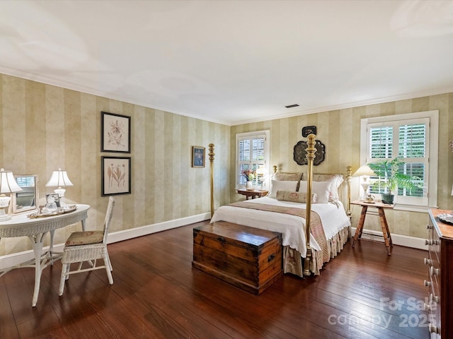 bedroom featuring multiple windows, dark wood-style flooring, wallpapered walls, baseboards, and ornamental molding