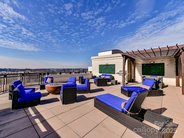 view of patio / terrace with an outdoor living space with a fire pit and a pergola
