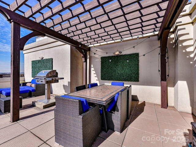 view of patio / terrace featuring exterior kitchen, a pergola, outdoor dining area, and a grill