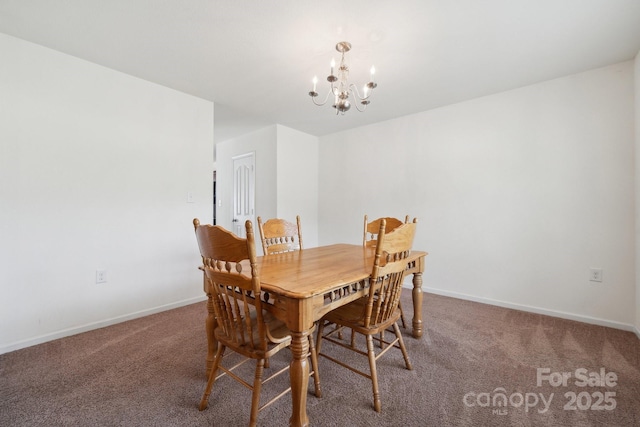 carpeted dining room featuring baseboards and an inviting chandelier