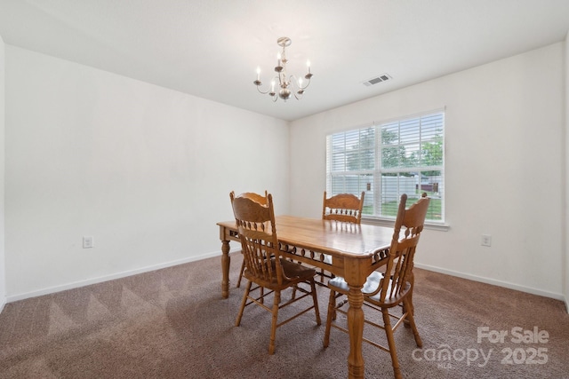 dining room with carpet floors, baseboards, a notable chandelier, and visible vents