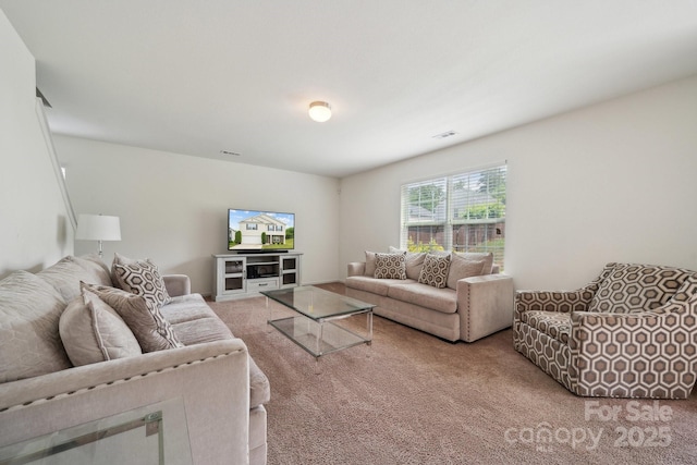 carpeted living room featuring visible vents