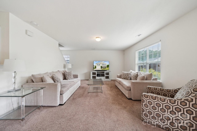 carpeted living room with visible vents