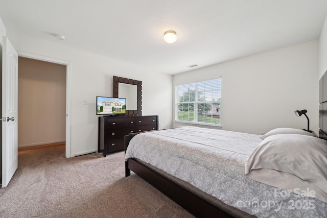 bedroom featuring carpet floors, baseboards, and visible vents