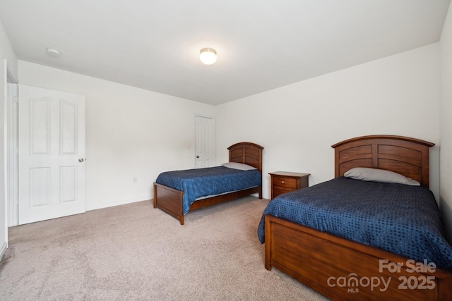 bedroom featuring baseboards and carpet flooring