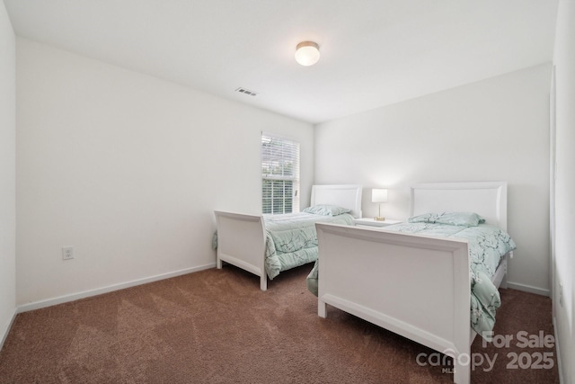 bedroom featuring baseboards, carpet flooring, and visible vents