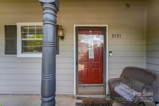 property entrance with covered porch