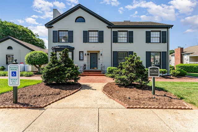 view of front of property featuring a chimney