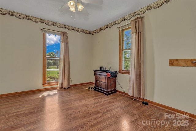676 Arrowhead Trl Unit 6, Marion, NC 28752 - spare room with light wood finished floors, a ceiling fan, and baseboards