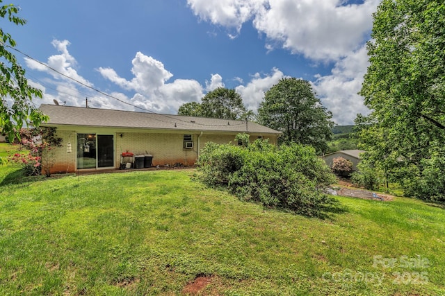 676 Arrowhead Trl Unit 6, Marion, NC 28752 - back of house featuring a lawn and brick siding