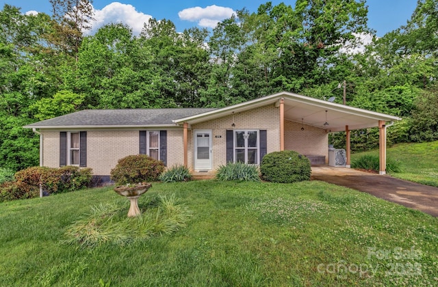 676 Arrowhead Trl Unit 6, Marion, NC 28752 - view of front of house featuring brick siding, a front yard, driveway, and an attached carport
