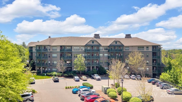 view of property featuring uncovered parking