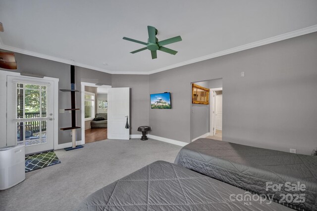 carpeted bedroom with baseboards, ornamental molding, and ceiling fan