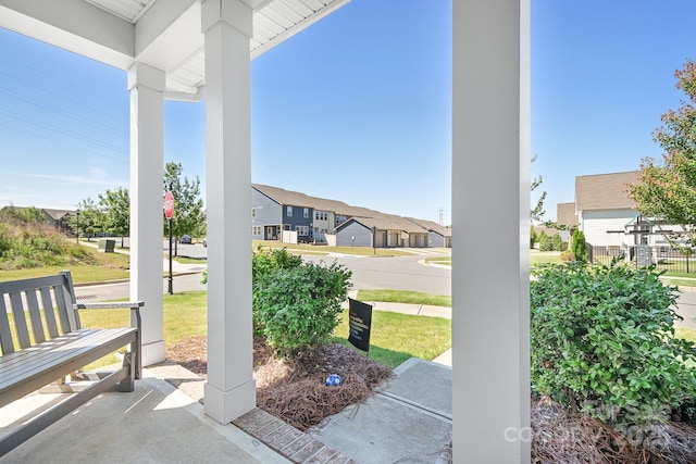 view of patio / terrace with a porch and a residential view