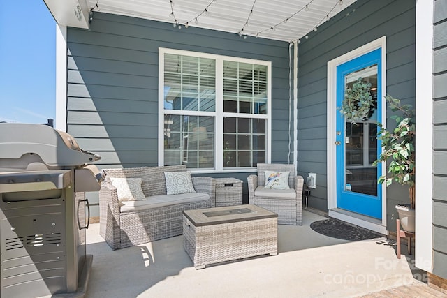 view of patio featuring an outdoor hangout area and a grill