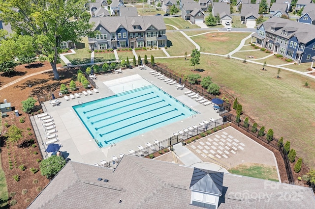 aerial view of residential area featuring a pool