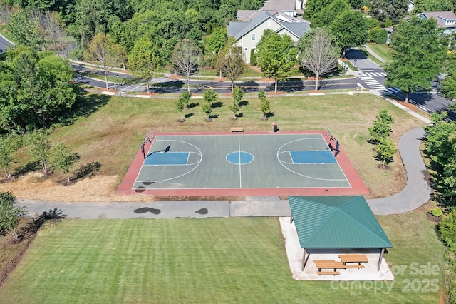 view of sport court featuring community basketball court and a yard