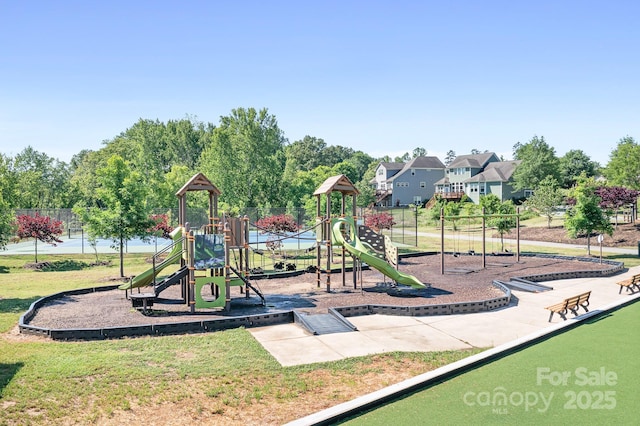 community jungle gym with a yard