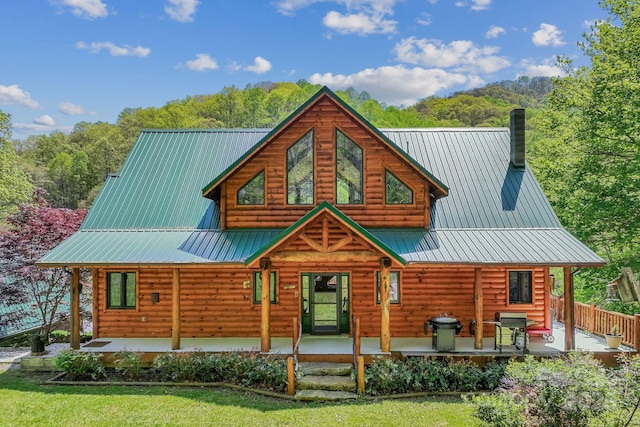 1104 Long Branch Rd, Mars Hill, NC 28754 - view of front of home with covered porch, metal roof, and a chimney