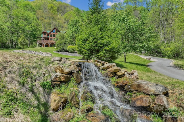 1104 Long Branch Rd, Mars Hill, NC 28754 - surrounding community with a view of trees, a deck, and a lawn