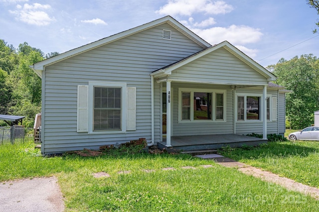 406 Arrowood St SE, Lenoir, NC 28645 - view of front facade featuring a porch and a front lawn
