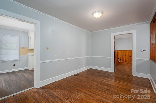 406 Arrowood St SE, Lenoir, NC 28645 - unfurnished room with crown molding, baseboards, and dark wood-style floors