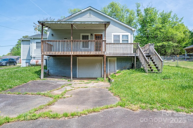 406 Arrowood St SE, Lenoir, NC 28645 - view of front of home featuring fence, a deck, and stairway