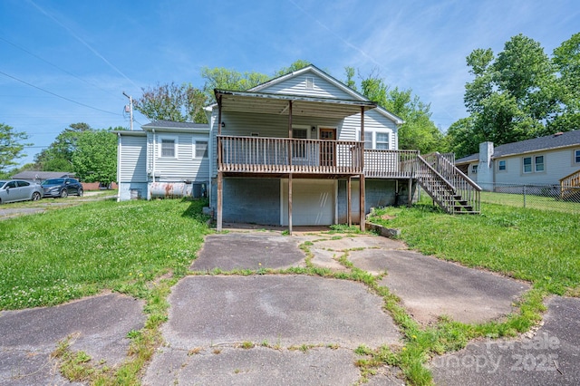406 Arrowood St SE, Lenoir, NC 28645 - view of front of home with stairway, fence, a front yard, and a deck