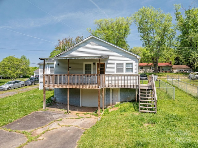 406 Arrowood St SE, Lenoir, NC 28645 - rear view of property featuring stairs, fence, a yard, and a deck