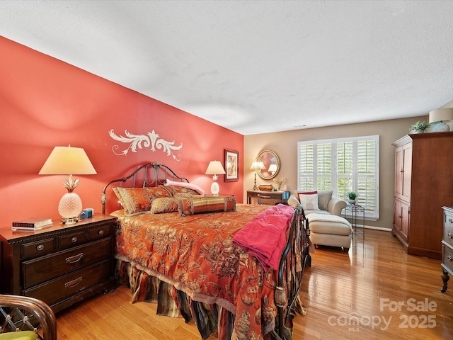 bedroom with light wood-style flooring